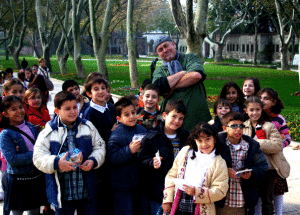 Mark posing with school children in Istanbul, Turkey